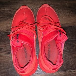 Red adidas tubulars